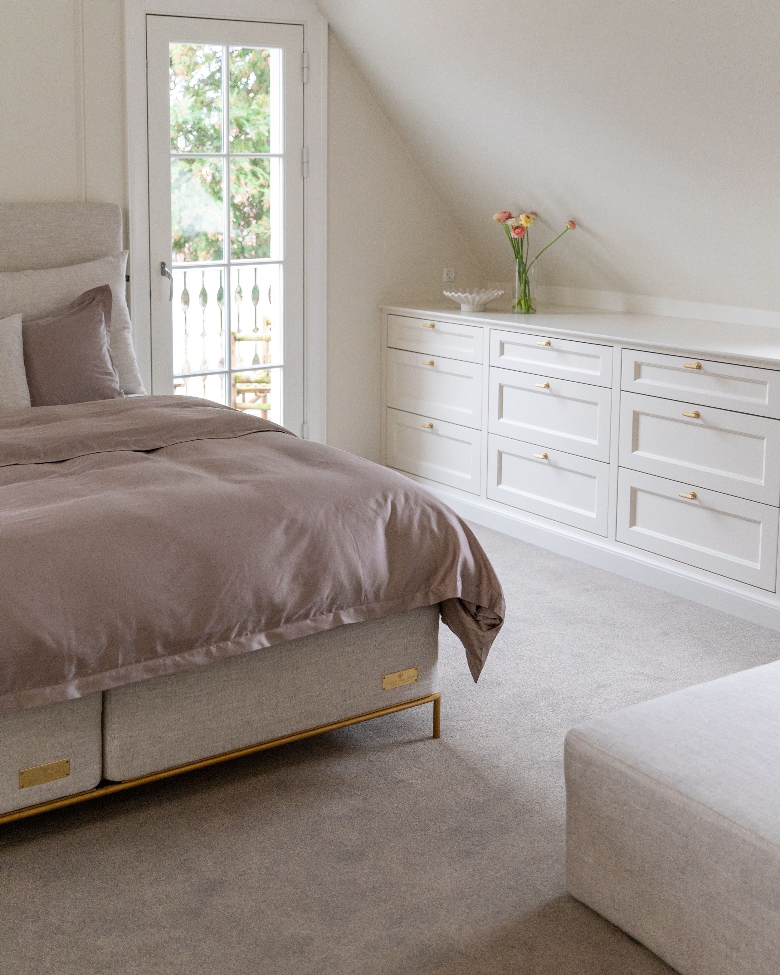 Anne Marie's bedroom featuring the Sandö Bed from Carpe Diem Beds. Designed to create a neutral, timeless, and relaxing feeling.