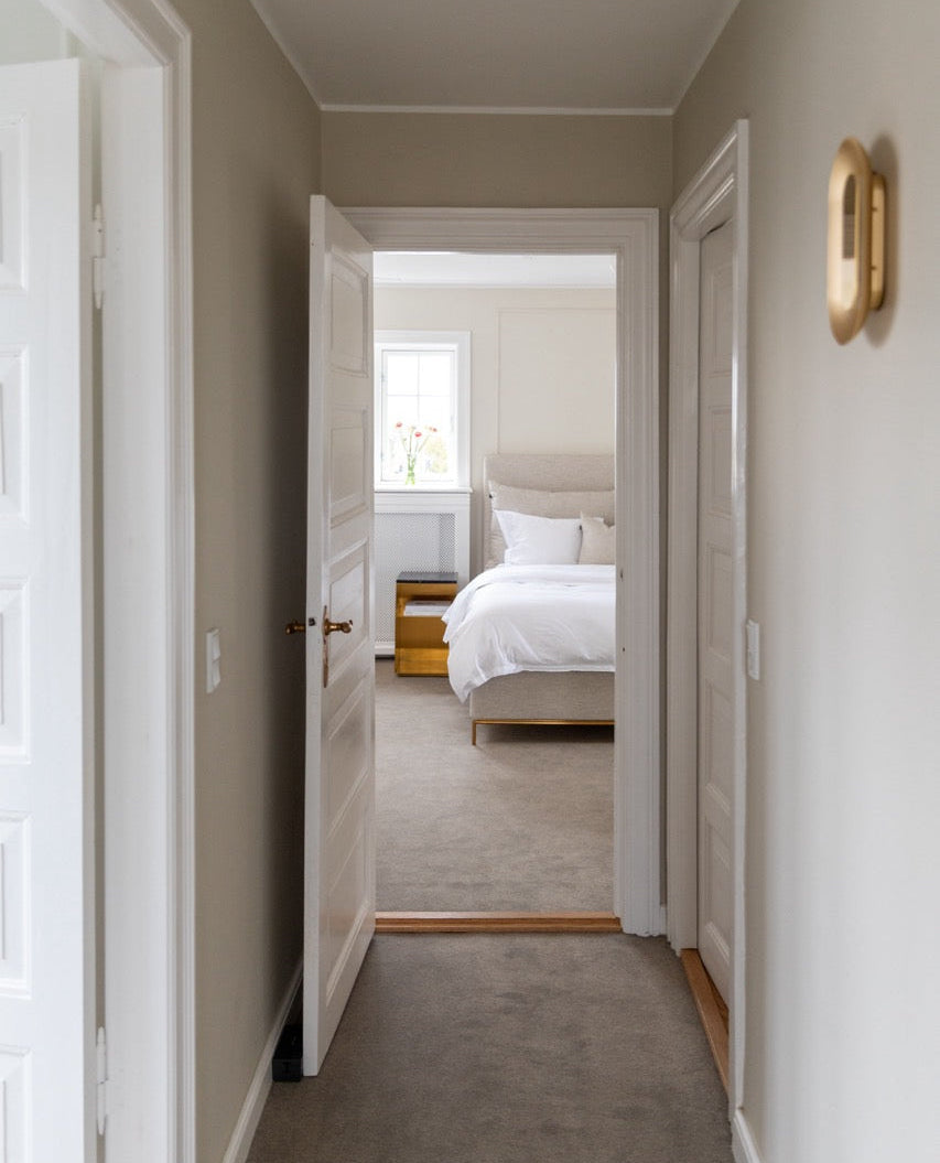  hallway leading to a bedroom with neutral tones